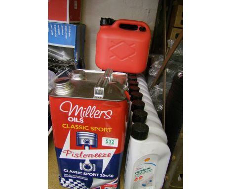 A selection of motor oils to include Millers classic sport and Shell easy care engine coolant and a pair Rhino fuel cans. Thi