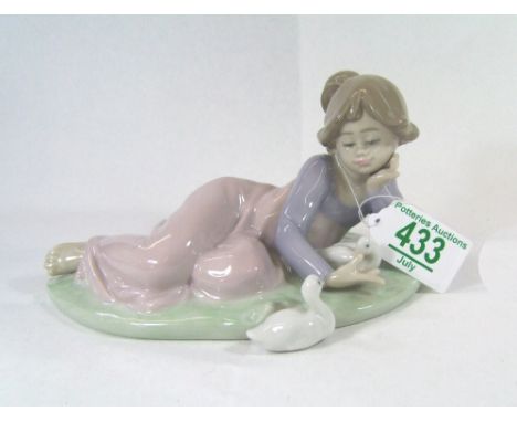 Lladro figure of a girl lying with ducks 5609