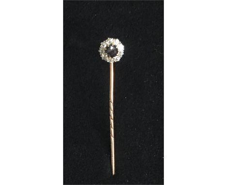 Antique sapphire and diamond stick pin high carat Gold set with Central Sapphire with Diamonds around Pin Measures approx 64m