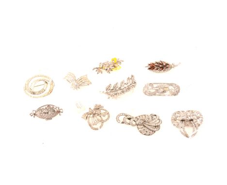 Ten vintage paste set brooches, a Boucher winged brooch set with baguettes, 50mm, Coro floral spray marked CP England, 70mm, 