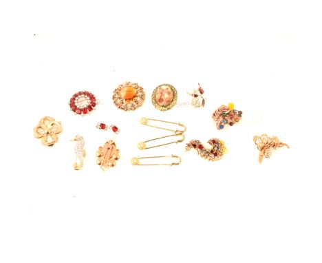 Vintage paste set yellow metal costume jewellery, a garnet coloured and clear paste garland brooch, 50mm, with matching earcl