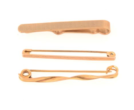 A 9 carat yellow gold 40mm engine turned tie bar, Birmingham 1966, 4.1gm, a 45mm narrow engine turned bar, marked A.J.H. 9ct,