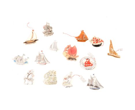 Fourteen nautical brooches, enamelled yacht "Made in England", 40mm, brown bakelite brooch, 35mm, marcasite galleon, 45mm, re