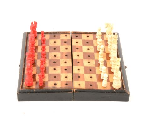 19th Century stained bone travel chess set, with folding board, king size 4.6cm tall (one pawn missing); along with a Elfin p