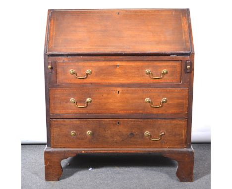 Edwardian mahogany bureau, with banding and stringing, fall-front enclosing a part-fitted interior, three drawers below, on b