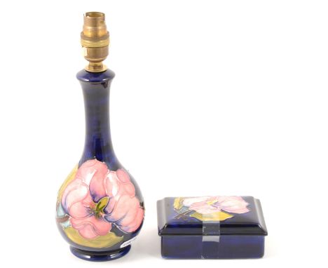 Moorcroft Pottery bottle-shape lamp base, Magnolia design, 29cm overall; and a Magnolia design box, width 13cm.