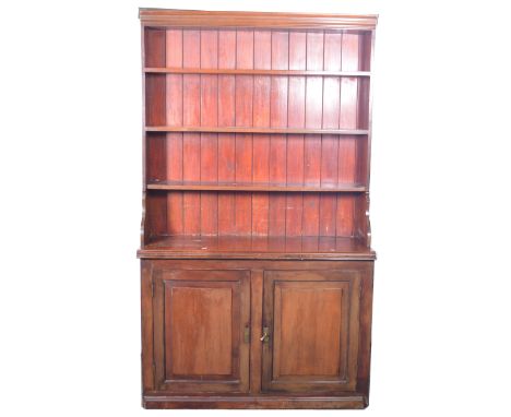 Large Victorian mahogany and stained wood bookcase, previously fitted, the dresser back with four shelves, above two panel cu