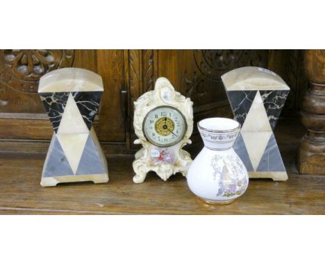 A pair of coloured marble bookends or ornaments, a small china mantle clock and a vase  