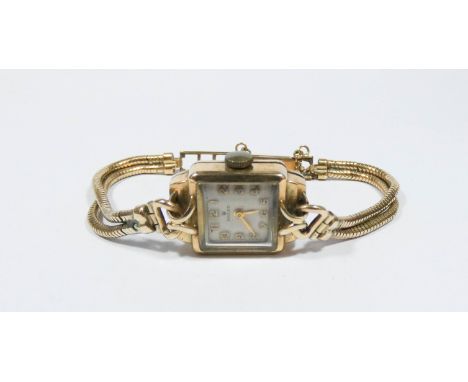 A ladies vintage Rolex 9ct gold square faced dress watch on flexible gold plated strap