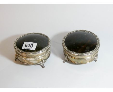 A pair of silver and tortoiseshell mounted circular trinket boxes, Birmingham 1917, approximately 9cms diameter.   Both boxes