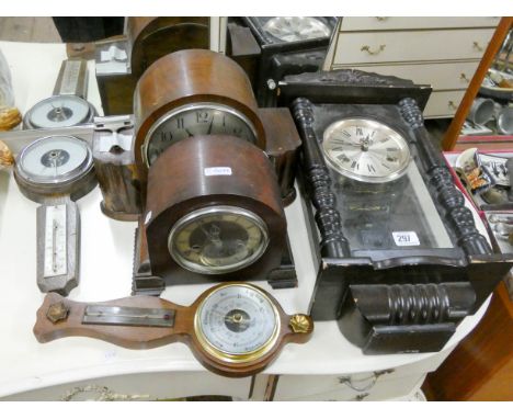 A 21 day striking wall clock, two oak cased mantle clocks and two barometers 