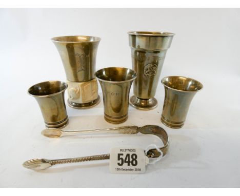 A pair of hallmarked silver sugar tongs together with a bone mounted goblet marked sterling USA and four beakers marked 830, 