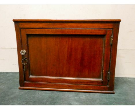 A small late Victorian mahogany single door cupboard 20 " wide 15" tall 