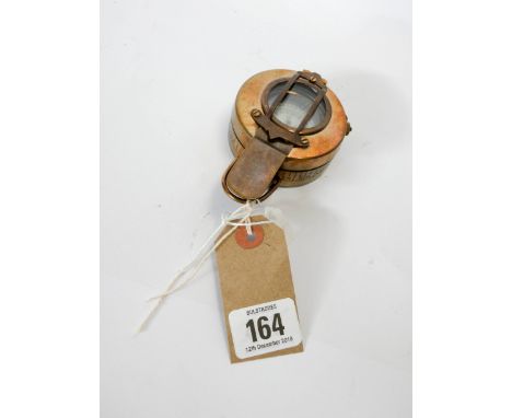 A reproduction brass compass 
