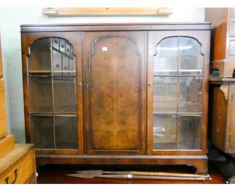 A walnut glazed two door bookcase with cupboards centre 4'6 wide 