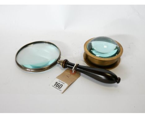 Heavy circular brass compass and a magnifying glass 