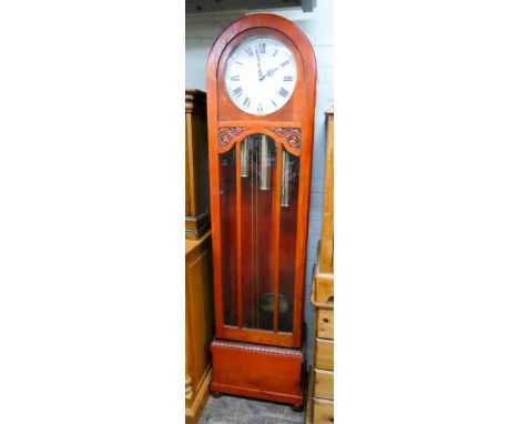 A 1930's oak dome topped Grandfather clock with white enamel dial, glass door showing the triple brass weights 