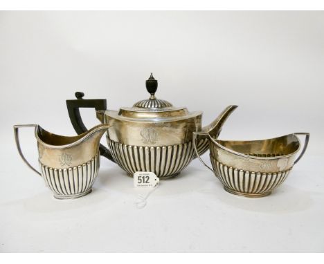 A three piece silver fluted tea set comprising teapot, sugar basin and milk jug, with hallmarks for Sheffield 1916-18, overal