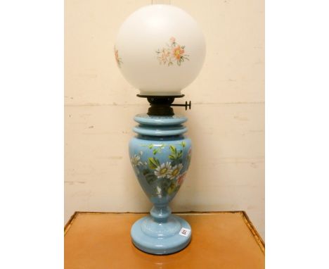 A Victorian and floral painted blue glass oil lamp with shade, approx 24" tall overall 
