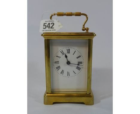 A French gilt brass carriage clock, 15cm tall with the handle up
