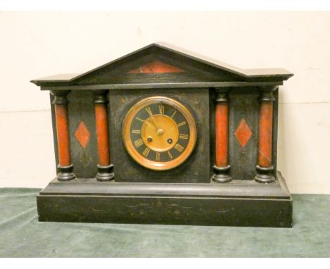 A large Victorian striking mantle clock in black marble case 