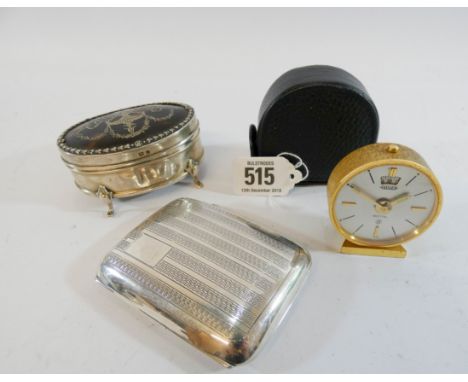 A silver and tortoiseshell pique work trinket box together with a silver cigarette case and a small alarm clock by Jaeger in 