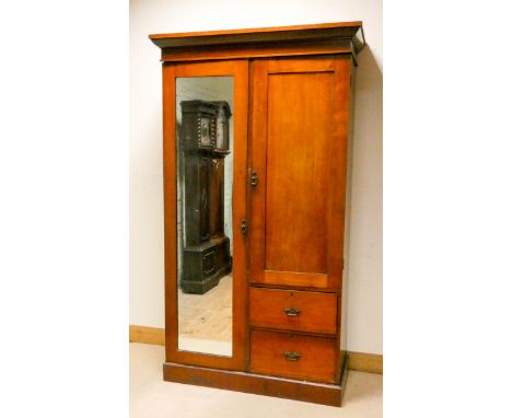 An Edwardian walnut Beaconsfield style wardrobe fitted one long mirror door, cupboard with shelves and two drawers, 3'6 wide 