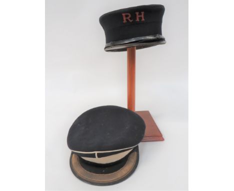 Royal Hospital Chelsea Peaked Cap black woollen body and crown. &nbsp;Black patent peak and narrow chinstrap. &nbsp;The front