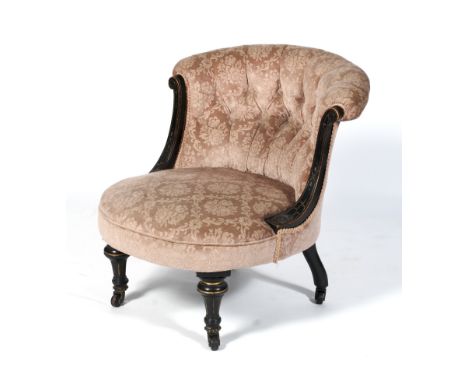 A late Victorian button back tub-shaped chair. Upholstered in pale pink floral pattern velvet, the ebonised arms carved with 