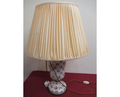 20th C gilt metal mounted pottery table lamp, transfer printed floral pattern baluster body with pleated shade H61cm 