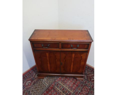 Yew style side cabinet with two drawers above pair of doors on bracket feet W76cm D28cm H77cm 