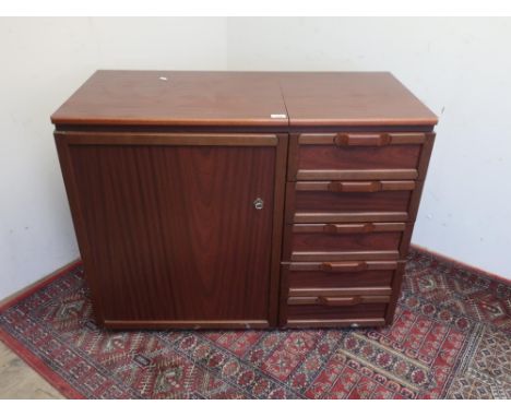 Singer Futura 2000 electric sewing machine, with white case in mahogany finish fitted cabinet with four drawers  ,with instru