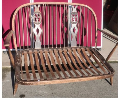 Two seater Ercol style sofa with rubber slats (lacking  cushions) H78cm W135cm D94cm 