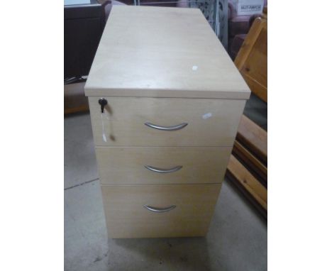 Office three drawer filing cabinet in light wood finish 