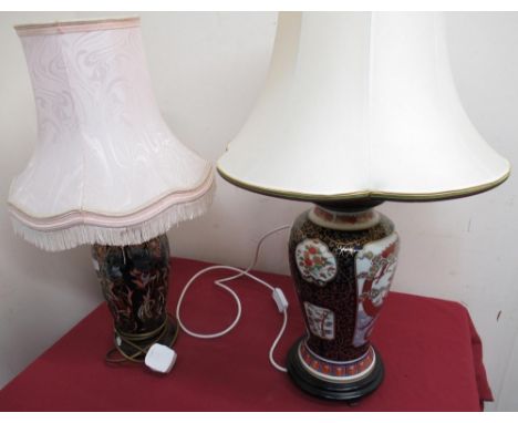 Oriental style table lamp, baluster body decorated with a dragon chasing pearl on turned wooden base with shade, another face