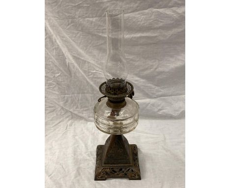 A METAL BASED EMBOSSED VINTAGE OIL LAMP HEIGHT 58CM 