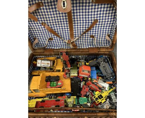 A WICKER PICNIC BASKET CONTAINING APPROX 80 DINKY AND CORGI ARS DATING FRO 1972 ONWARDS, PLUS 2 TONKA LORRIES 