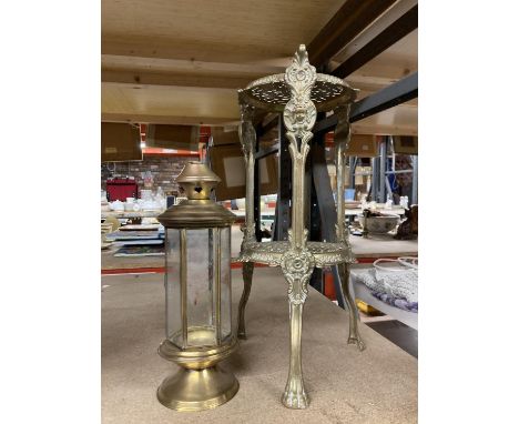 A DECORATIVE BRASS DOUBLE TRIVET AND A LANTERN 