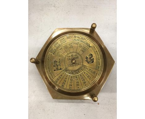 A BRASS CALENDAR AND COMPASS 