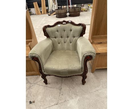 AN ITALIAN STYLE BUTTON-BACK FIRESIDE CHAIR 