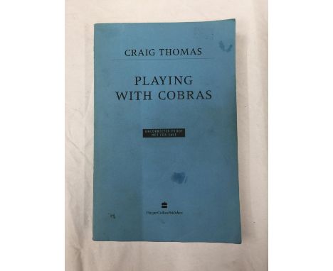 A FIRST EDITION UNCORRECTED INSCRIBED PROOF COPY PLAYING WITH COBRAS PAPERBACK BY CRAIG THOMAS PUBLISHED 1993 