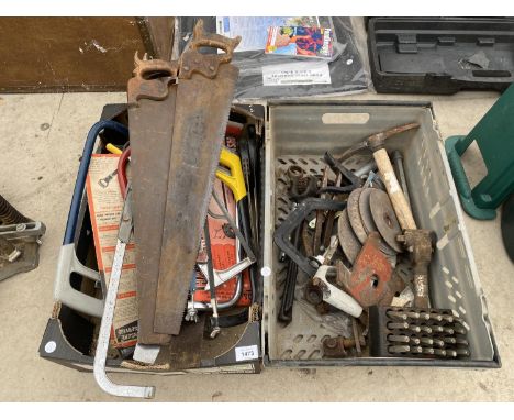 AN ASSORTMENT OF HAND TOOLS TO INCLUDE SAWS AND A PICK AXE ETC 