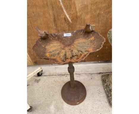 A VINTAGE CAST IRON BIRD BATH 