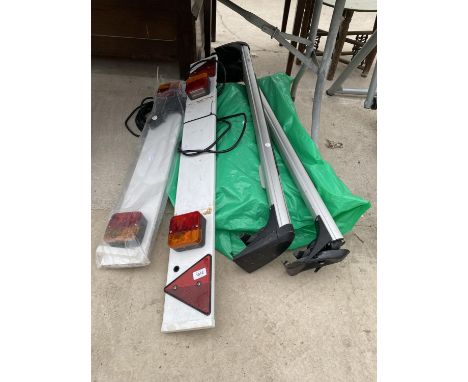 A SET OF TWO CAR ROOF BARS AND TWO TRAILER LIGHT BOARDS 