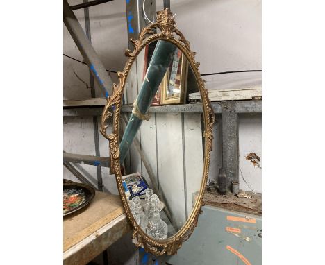 A VINTAGE STYLE GILT FRAMED OVAL MIRROR 66CM X 36CM APPROX 
