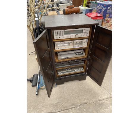 AN OAK MEDIA UNIT CONTAINING AN ASSORTMENT OF STEREO EQUIPMENT TO INCLUDE A JVC STEREO RECEIVER, A JVC RECORD PLAYER AND A TE