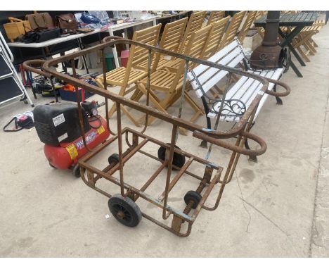A VINTAGE CAST IRON FOUR WHEELED LAUNDRY TROLLEY 