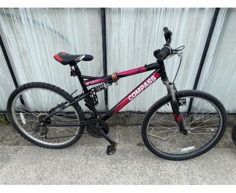 A LADIES COMPASS MOUNTAIN BIKE WITH FRONT AND REAR SUSPENSION AND 21 SPEED SHIMANO GEAR SYSTEM 