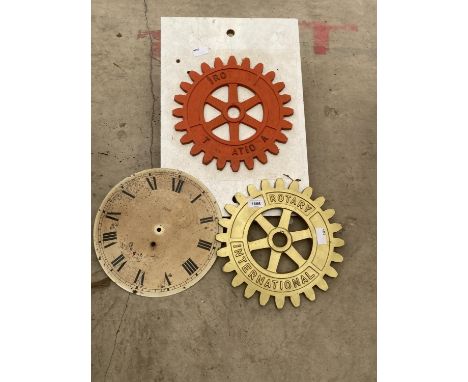 A ROTARY INTERNATIONAL COG, A TEMPLATE AND A CLOCK FACE 