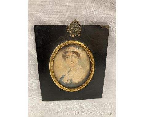 A GEORGIAN PERIOD WATERCOLOUR PORTRAIT MINIATURE OF A LADY. DATED TO REVERSE 1743.  APPROX 10.5CM X 12.5CM 